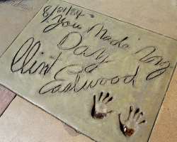 He has his hands and footprints in cement at Grauman's Chinese Theatre but does not have a star on the Hollywood Walk of Fame to the date.